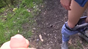 Czech guy with admirable blond hair bangs in a park